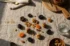 dry fruits vs fresh fruits: premium product photography on warm linen